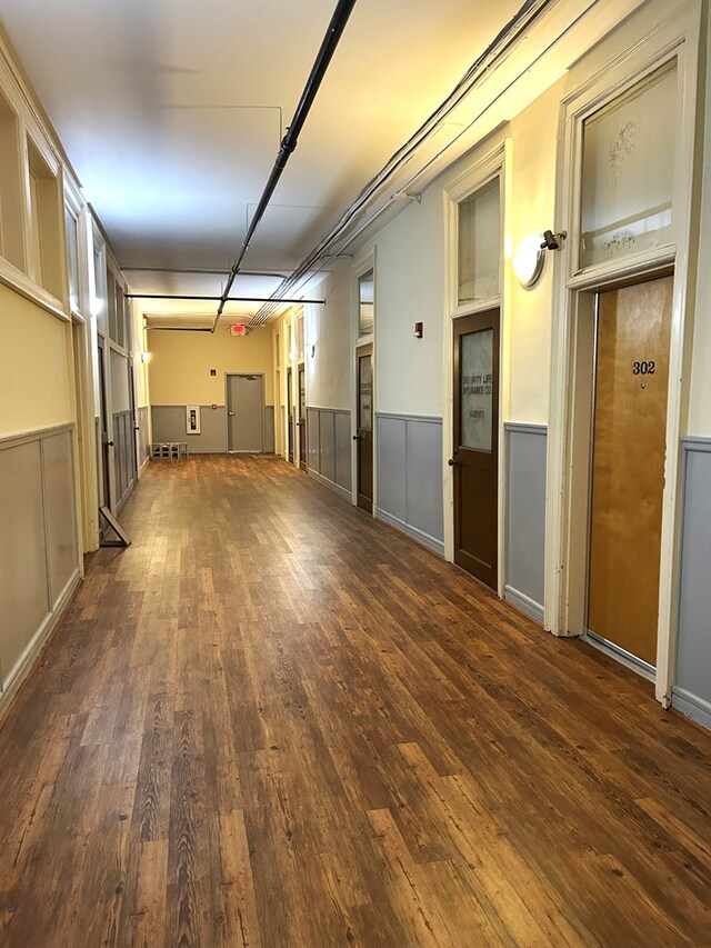 bedroom with dark hardwood / wood-style floors