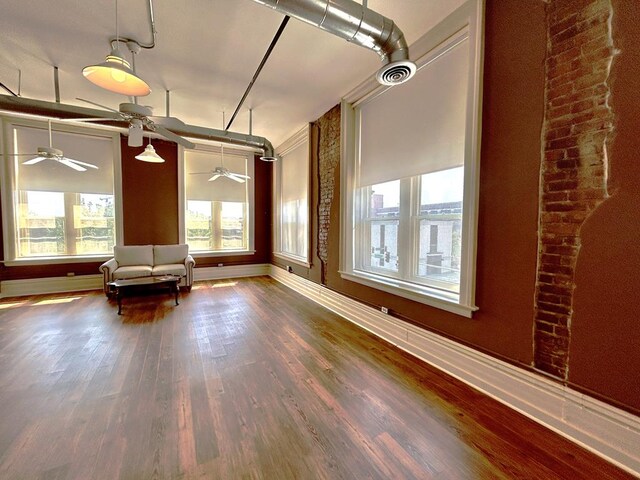 carpeted living room featuring ceiling fan