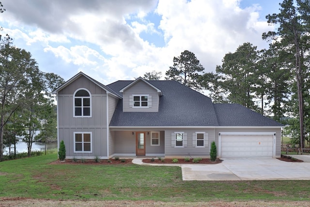 view of front of property featuring a porch, a garage, and a front lawn