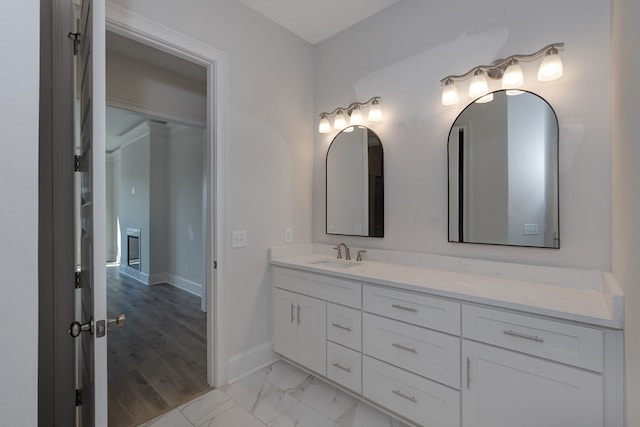 bathroom with hardwood / wood-style floors and vanity