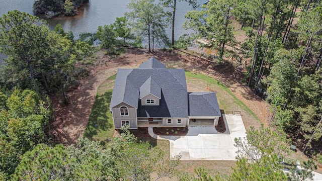 birds eye view of property with a water view