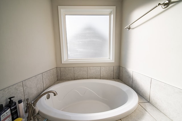 bathroom with a tub to relax in