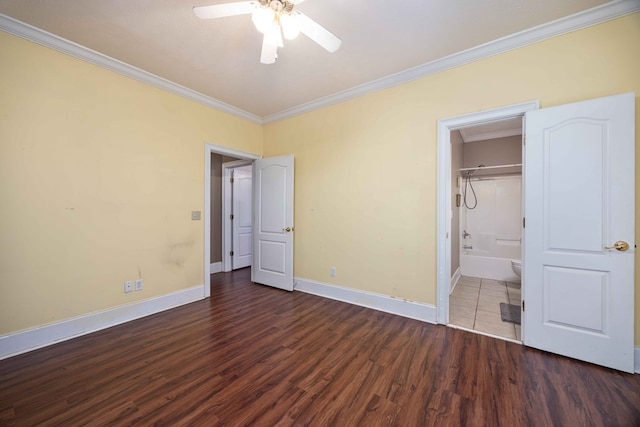 unfurnished bedroom featuring a closet, ornamental molding, dark hardwood / wood-style floors, and ceiling fan