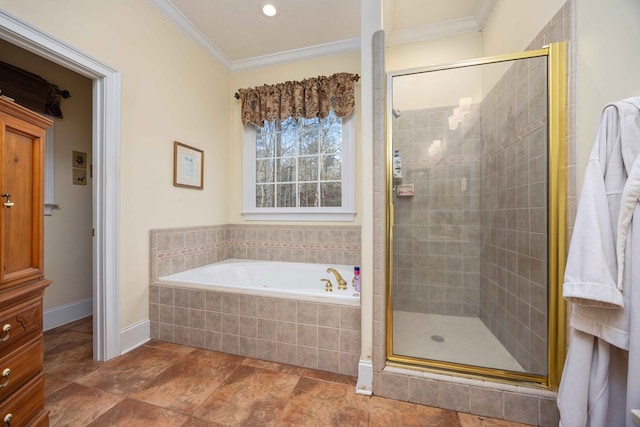 bathroom featuring crown molding and separate shower and tub