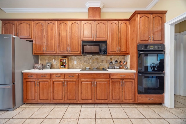 kitchen with tasteful backsplash, light tile patterned floors, crown molding, and black appliances