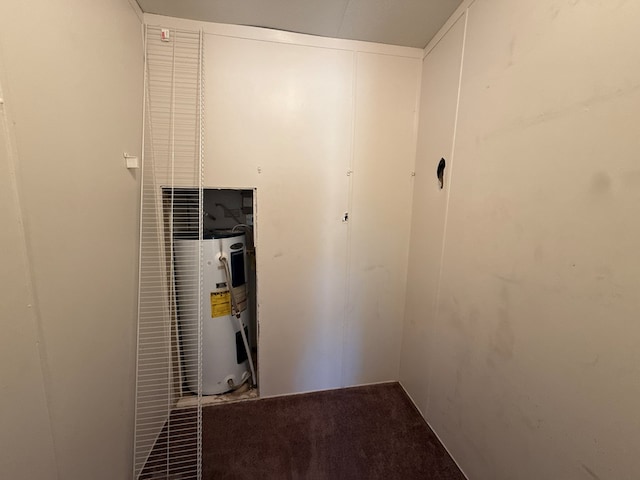 utility room featuring water heater