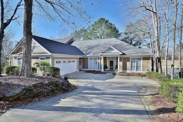 view of front facade with a garage and concrete driveway