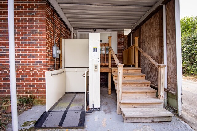 view of patio / terrace with central AC unit and a carport