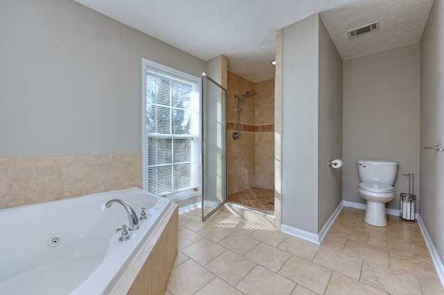 full bath with visible vents, toilet, a textured ceiling, a jetted tub, and a shower stall