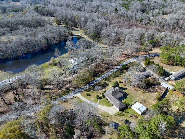 bird's eye view featuring a view of trees and a water view