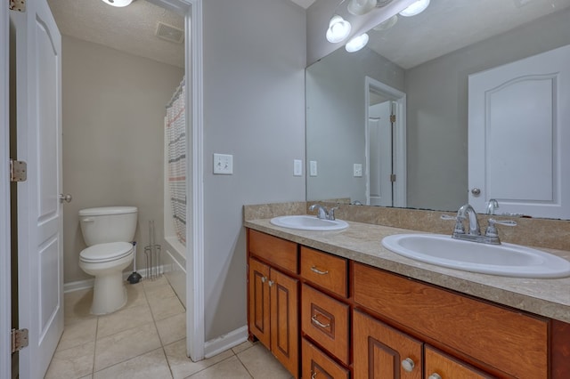 full bathroom featuring tile patterned floors, visible vents, double vanity, and a sink