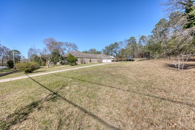 view of yard featuring an attached garage