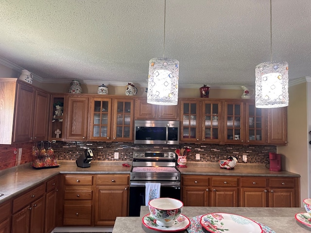 283 Roberts Rd, Hahira, GA 31632 - kitchen with appliances with stainless steel finishes, brown cabinets, crown molding, tasteful backsplash, and a textured ceiling