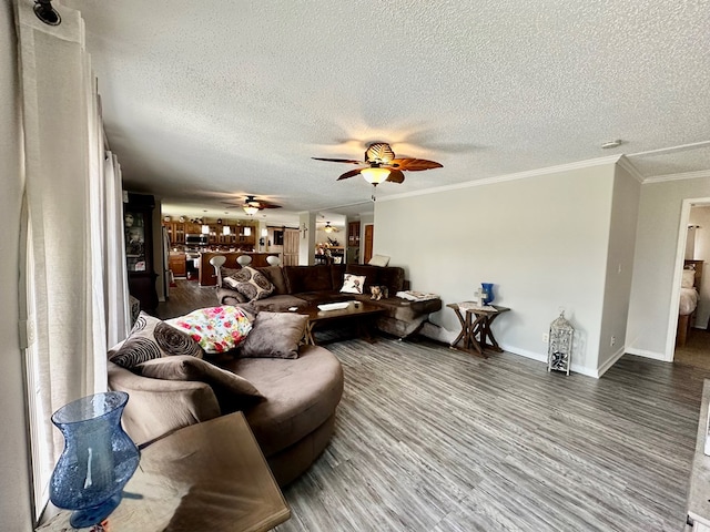 283 Roberts Rd, Hahira, GA 31632 - living room with a ceiling fan, a textured ceiling, wood finished floors, baseboards, and ornamental molding