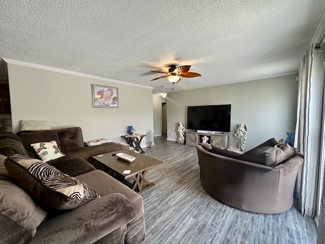 283 Roberts Rd, Hahira, GA 31632 - living room featuring wood finished floors, ceiling fan, baseboards, crown molding, and a textured ceiling