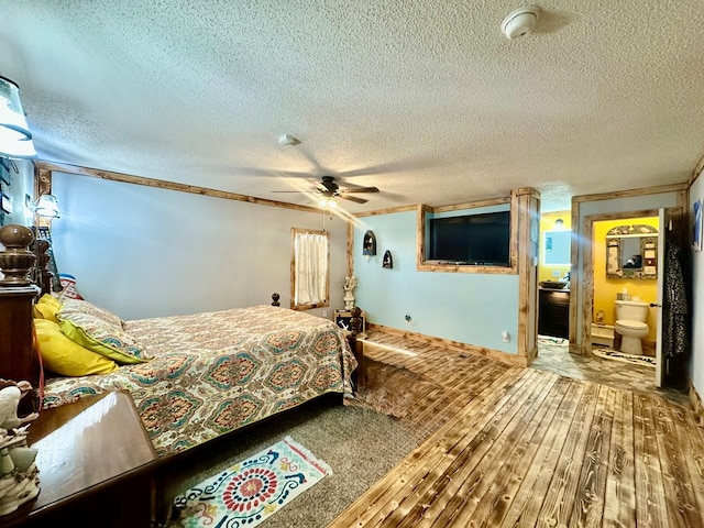 283 Roberts Rd, Hahira, GA 31632 - bedroom with a textured ceiling, wood finished floors, and ceiling fan