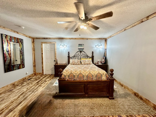 283 Roberts Rd, Hahira, GA 31632 - bedroom with a textured ceiling, wood finished floors, a ceiling fan, crown molding, and baseboards
