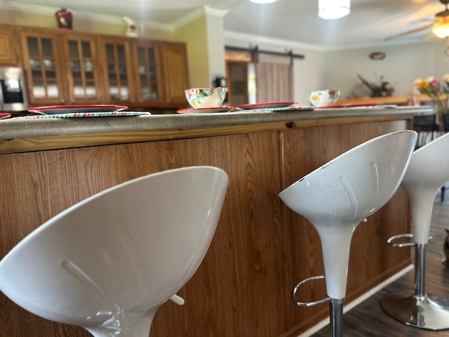 283 Roberts Rd, Hahira, GA 31632 - bar area featuring crown molding and wood finished floors