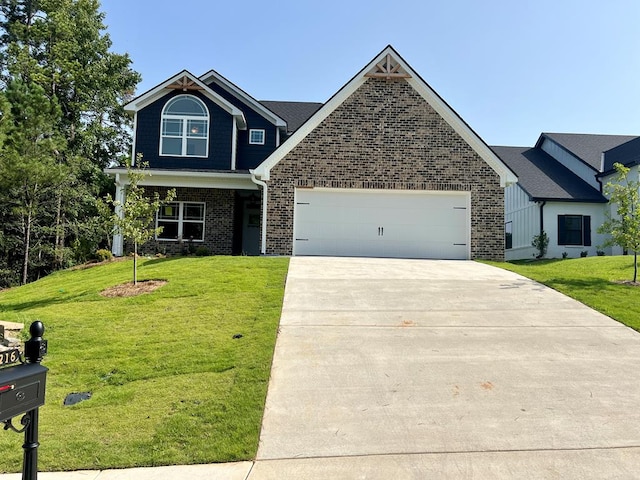 view of front of house with a front yard and a garage