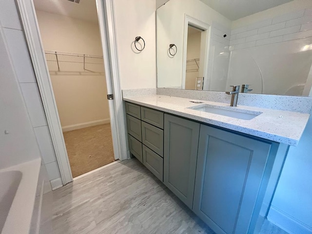 bathroom featuring vanity and shower / bathing tub combination