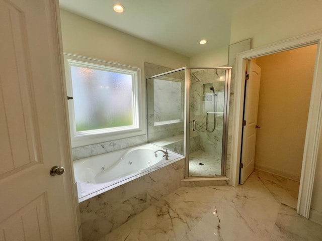 bathroom with shower with separate bathtub