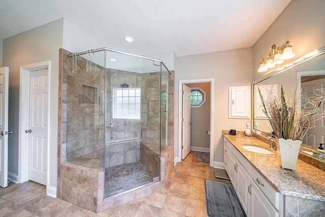 8039 Adelaide Dr, Columbus, GA 31909 - bathroom featuring baseboards, a stall shower, vanity, and tile patterned floors