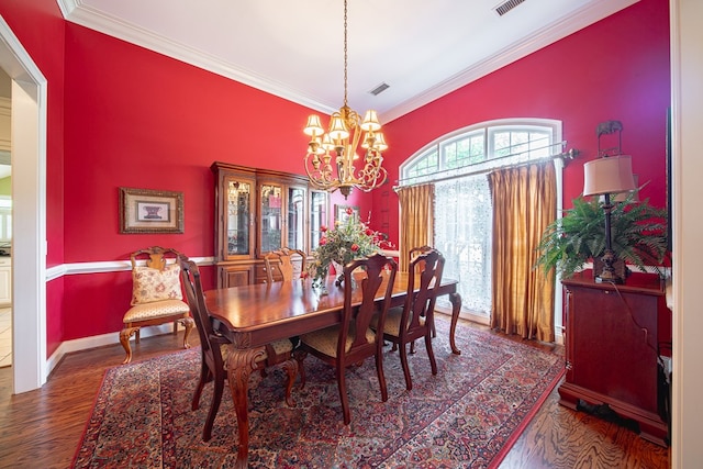 8039 Adelaide Dr, Columbus, GA 31909 - dining area featuring crown molding, a chandelier, wood finished floors, and baseboards