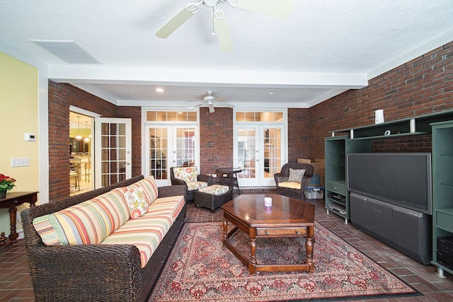 8039 Adelaide Dr, Columbus, GA 31909 - living room featuring french doors, ceiling fan, brick floors, brick wall, and beamed ceiling