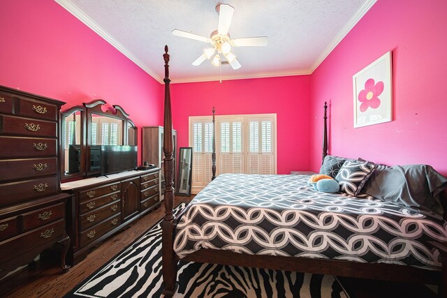 8039 Adelaide Dr, Columbus, GA 31909 - bedroom featuring a textured ceiling, dark wood finished floors, ornamental molding, and a ceiling fan
