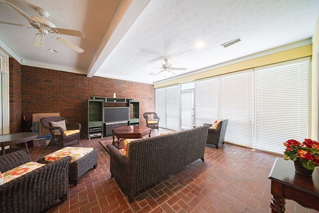8039 Adelaide Dr, Columbus, GA 31909 - living area with a ceiling fan, brick wall, brick floors, and a textured ceiling