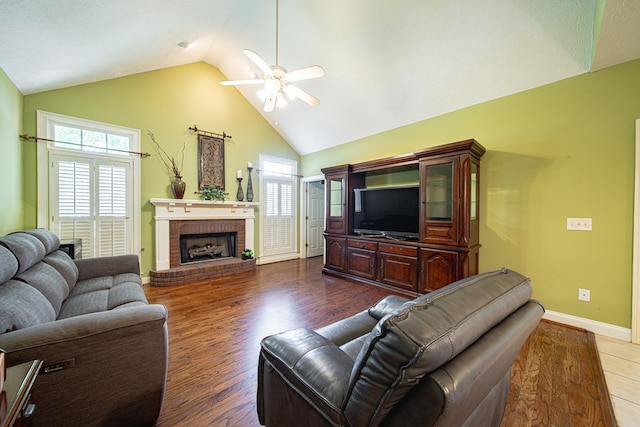 8039 Adelaide Dr, Columbus, GA 31909 - living area with ceiling fan, wood finished floors, baseboards, high vaulted ceiling, and a fireplace