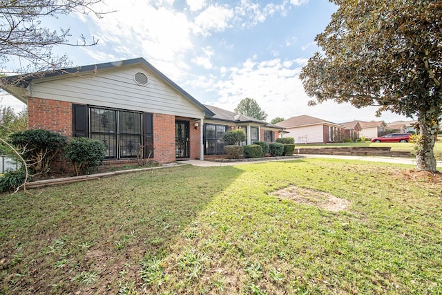 view of front of home with a front yard