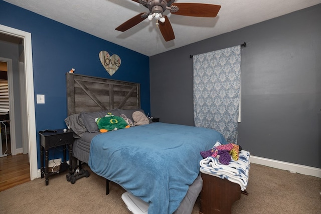 bedroom featuring carpet floors, ceiling fan, and baseboards