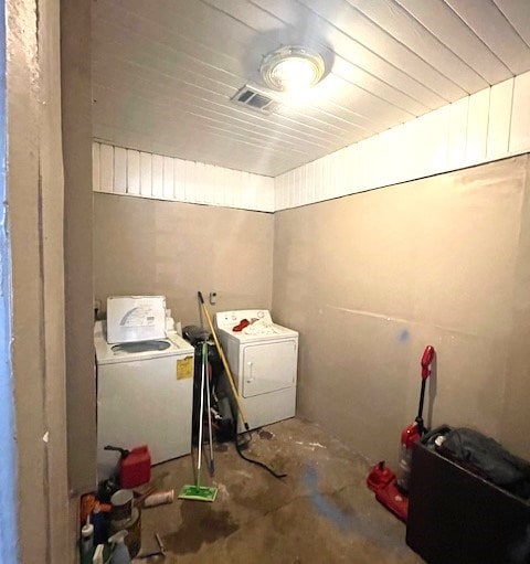 clothes washing area with washer and dryer