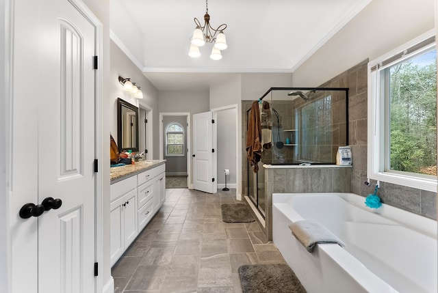 full bath featuring a garden tub, ornamental molding, vanity, a shower stall, and a chandelier