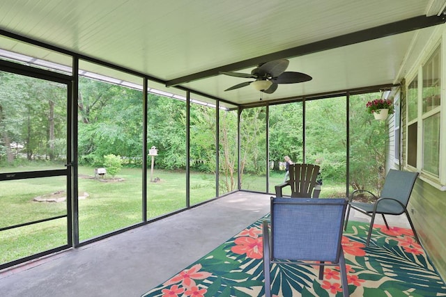 sunroom with a ceiling fan