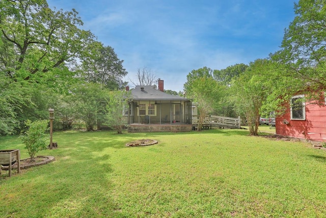 view of yard featuring a sunroom