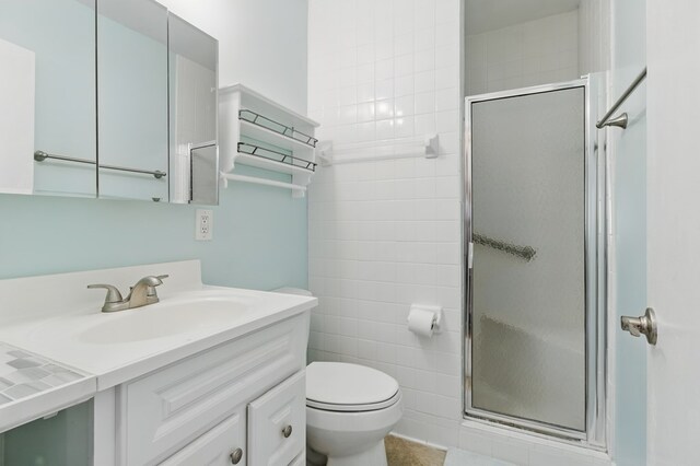 2608 5th Ave, Phenix City, AL 36867 - full bath featuring a shower stall, vanity, and toilet