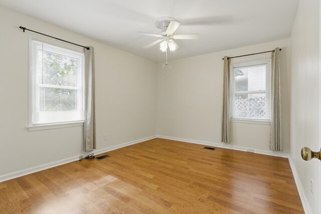 2608 5th Ave, Phenix City, AL 36867 - empty room featuring a ceiling fan, light wood-type flooring, and baseboards