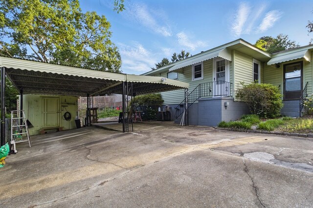 2608 5th Ave, Phenix City, AL 36867 - view of car parking with driveway and a carport