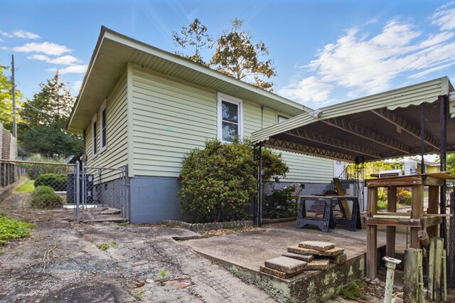 2608 5th Ave, Phenix City, AL 36867 - back of property featuring central AC unit and crawl space