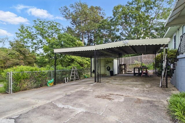 2608 5th Ave, Phenix City, AL 36867 - view of car parking featuring concrete driveway and a detached carport