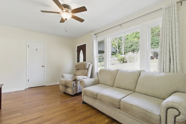 2608 5th Ave, Phenix City, AL 36867 - living area featuring wood finished floors, ceiling fan, and baseboards