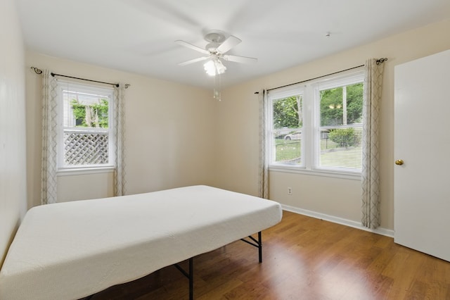 2608 5th Ave, Phenix City, AL 36867 - bedroom with wood finished floors, baseboards, and a ceiling fan