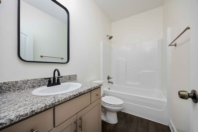 1170 Railroad Ave, Smiths Station, AL 36877 - bathroom featuring vanity, toilet, wood finished floors, and shower / bathtub combination