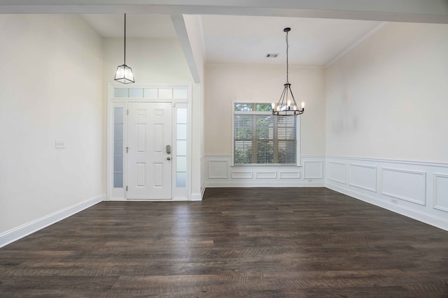 1170 Railroad Ave, Smiths Station, AL 36877 - foyer entrance with a chandelier, dark wood-style floors, crown molding, and wainscoting