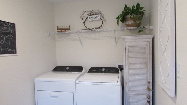 washroom with washer and clothes dryer