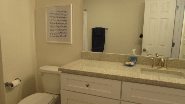 bathroom with vanity and toilet