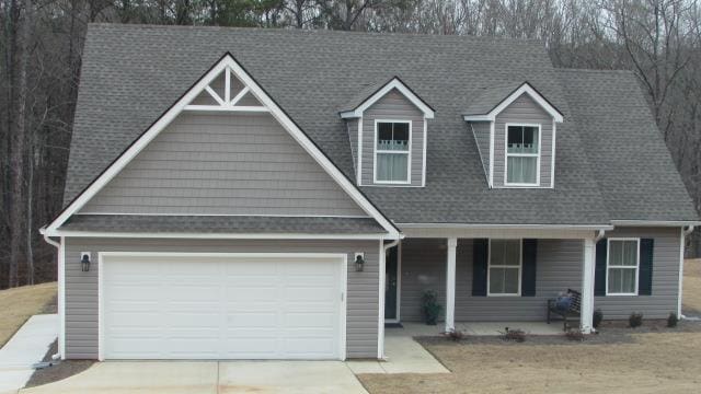 view of front facade featuring a garage and a porch