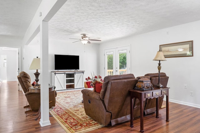 3796 Auburn Rd, Phenix City, AL 36870 - living room with dark wood-style flooring, a ceiling fan, french doors, and a textured ceiling
